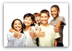 Happy kids, smiling, and thumbs up over white background